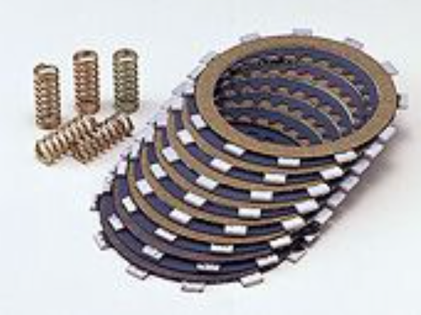 Stack of brake pads with springs on a white background