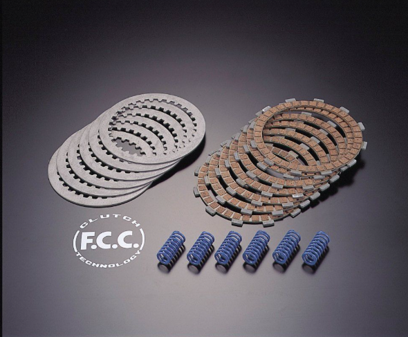 Clutch components including plates and springs on a dark background with F.C.C. branding.