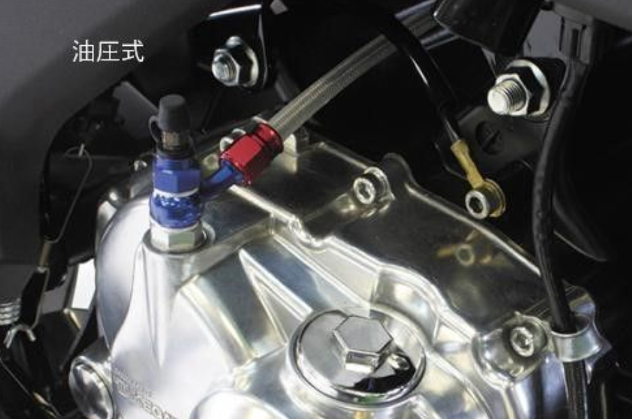 Close-up of a mechanical component with oil pressure indicator on a vehicle.