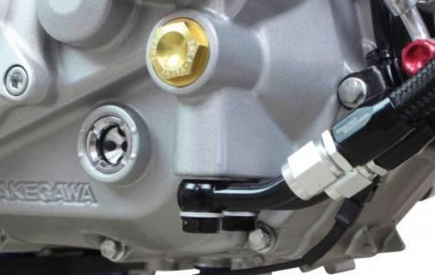Close-up of a motorcycle engine with 'Yakawa' branding on a white background