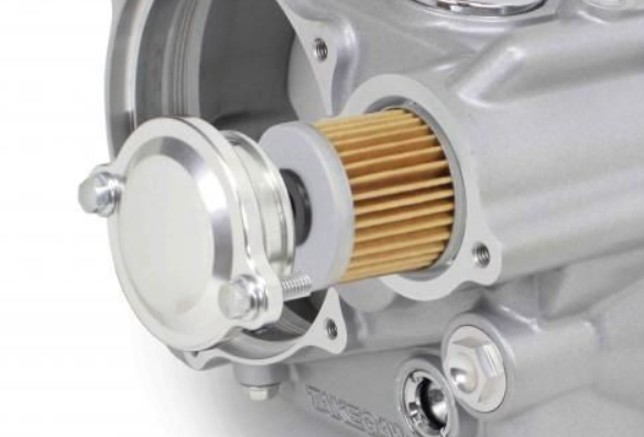 Close-up of a mechanical component with gold filter on a white background