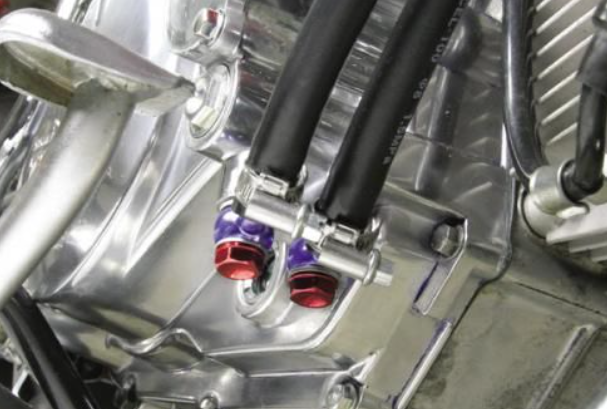Close-up of a motorcycle engine with visible components and wiring.
