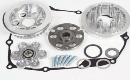 Automotive repair parts including gears and bearings on a white background
