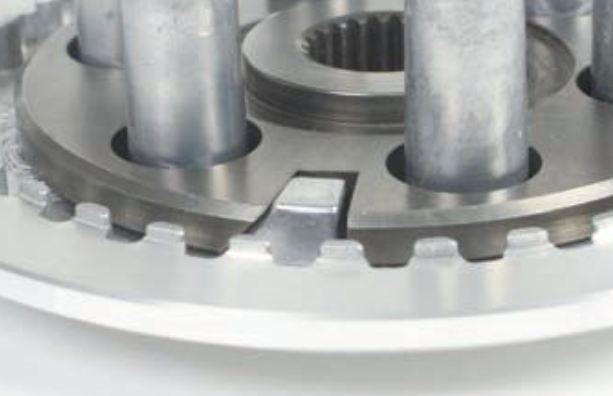 Close-up of a metal gear and bearing assembly on a white background
