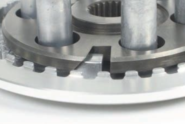Close-up of a mechanical gear component on a white background