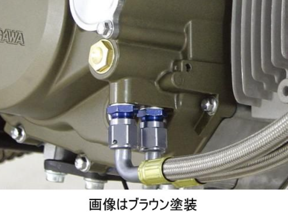 Close-up of mechanical components with hoses and connectors on a brown background
