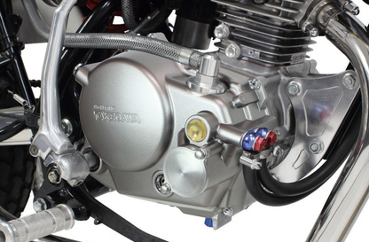 Close-up of a motorcycle engine with visible branding on a white background