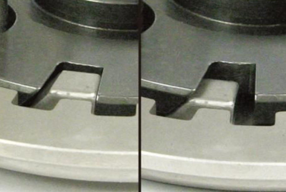 Close-up of a metal stove burner with a black line dividing two similar images.
