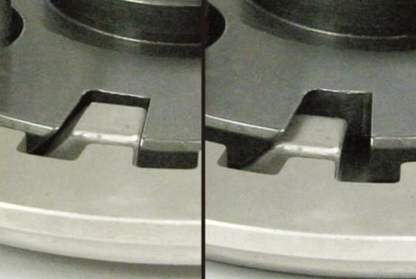 Close-up of a metal stove burner with a black line dividing two similar images.