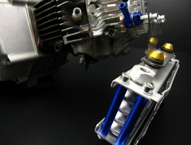 Close-up of a mechanical component with blue and gold parts on a dark background