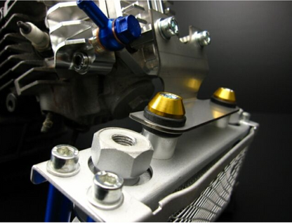 Close-up of a mechanical component with bolts and a black background