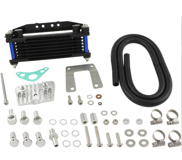 Collection of automotive parts including a black oil cooler, hoses, metal brackets, and small components on a white background.