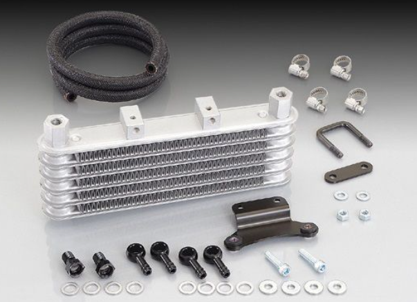 Oil cooler kit with various components on a gray background