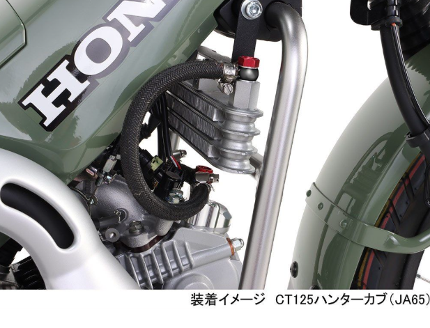 Close-up of a Honda motorcycle with visible branding and mechanical details.