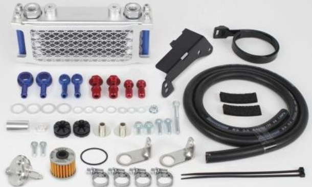 Collection of automotive parts including hoses, brackets, and filters on a white background