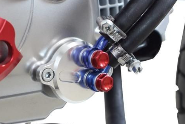 Close-up of a motorcycle's brake lever with red and blue accents on a blurred background