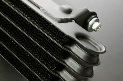 Close-up of a car radiator on a gray background