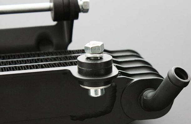 Close-up of a mechanical component with a bolt on a gray background