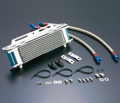 Oil cooler kit with hoses, brackets, and fasteners on a dark background