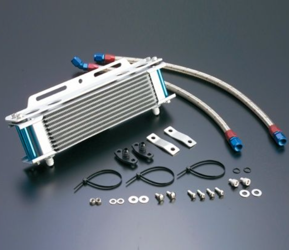 Oil cooler kit with hoses, brackets, and fasteners on a dark background