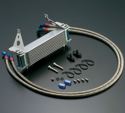 Oil cooler kit with hoses and connectors on a dark background