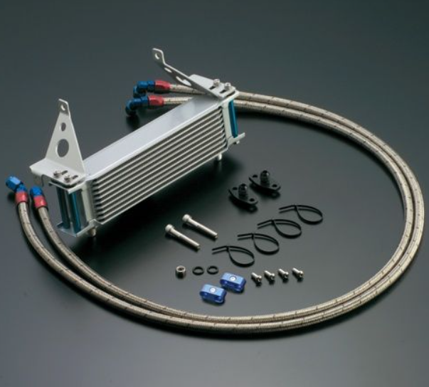 Oil cooler kit with hoses and connectors on a dark background