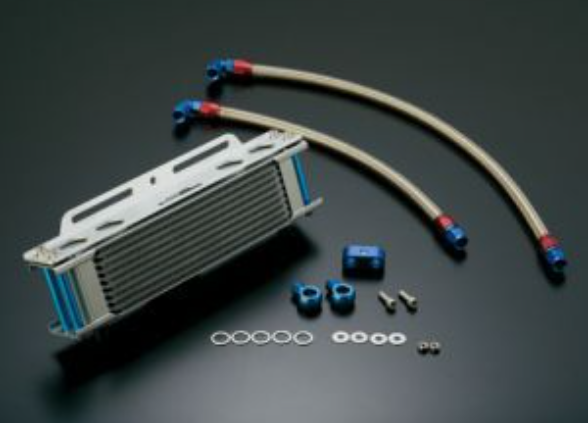 Oil cooler kit with hoses and connectors on a dark background