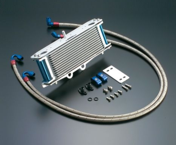 Oil cooler kit with hoses and connectors on a dark background