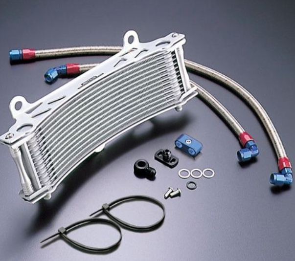 Oil cooler with hoses and connectors on a gray background
