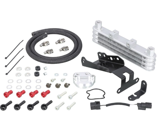 Collection of automotive parts including a metal oil cooler, hoses, and connectors on a white background.