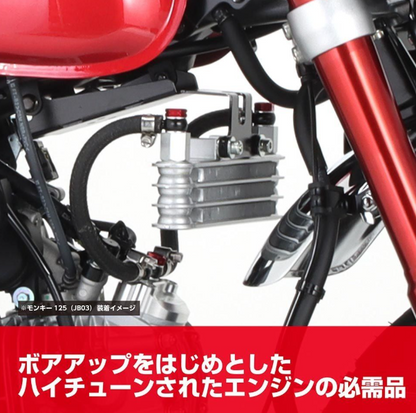 Close-up of a motorcycle engine with visible branding and text.