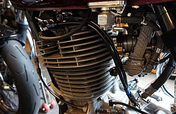 Close-up of a motorcycle engine with visible components.