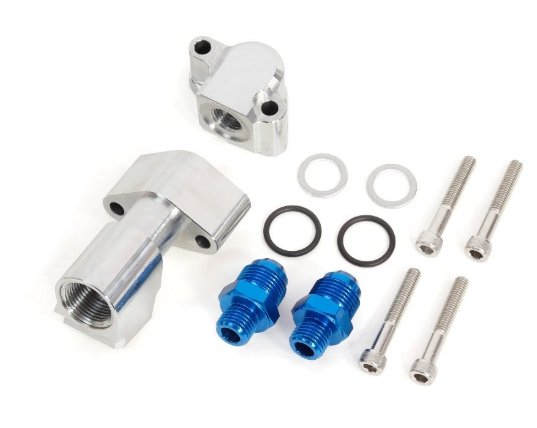 Mechanical parts including a silver fitting, blue connectors, and various metal components on a white background.