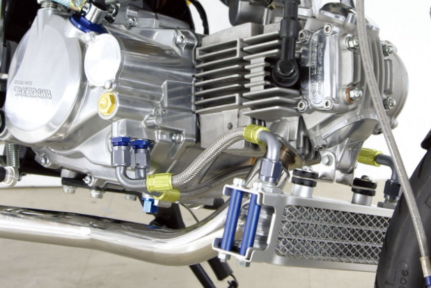 Close-up of a motorcycle engine with visible branding