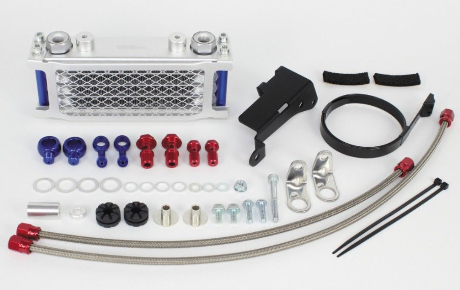 Collection of automotive parts including hoses, clamps, and metal components on a white background