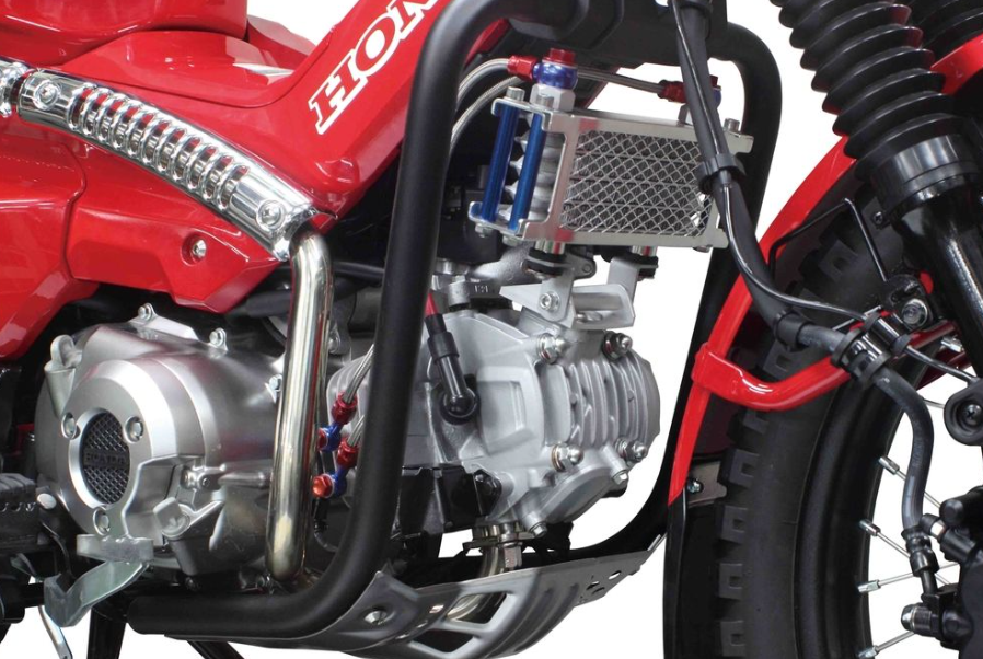 Close-up of a Honda motorcycle engine on a white background