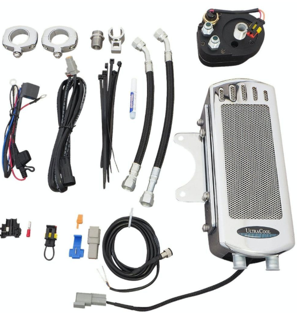Collection of automotive parts including a white fan and various connectors on a white background