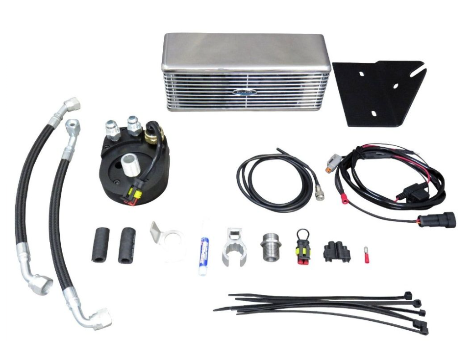 Collection of automotive parts including an oil cooler, hoses, and connectors on a white background