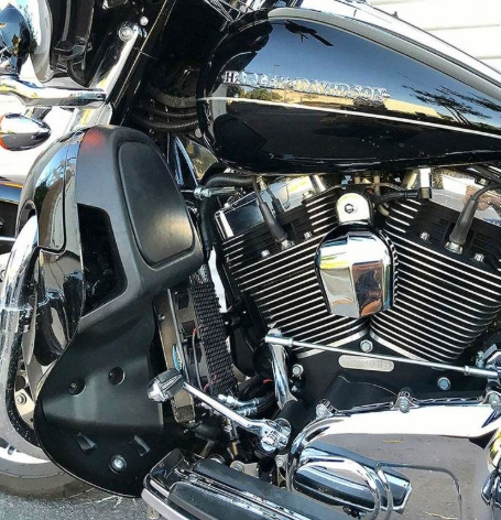 Close-up of a motorcycle engine with visible brand name