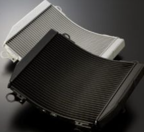 Two car radiators on a dark background