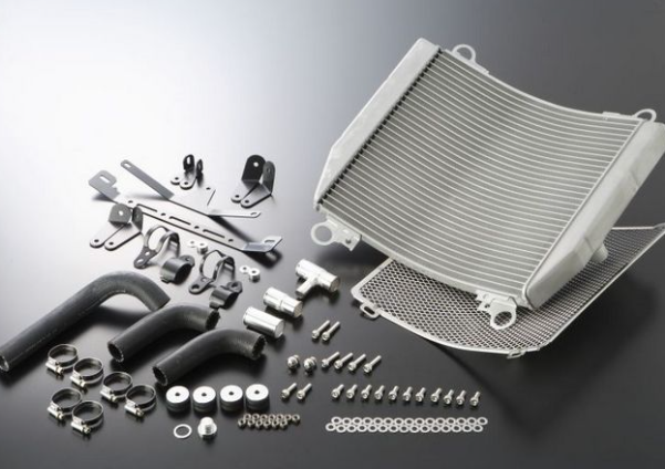 Automotive parts including a radiator and various connectors on a reflective surface