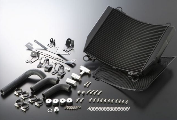 Car radiator and its components on a gray background