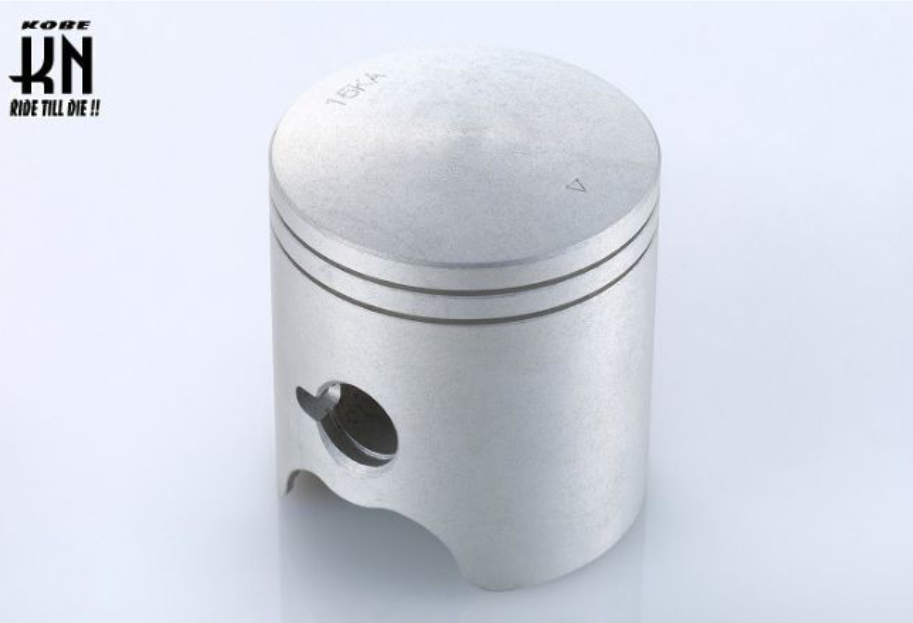 Metal piston on a light gray background with K&N logo.