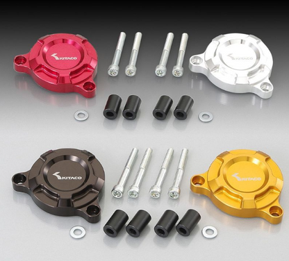 Set of KTM motorcycle parts including red, silver, brown, and gold covers with bolts and washers on a gray background.