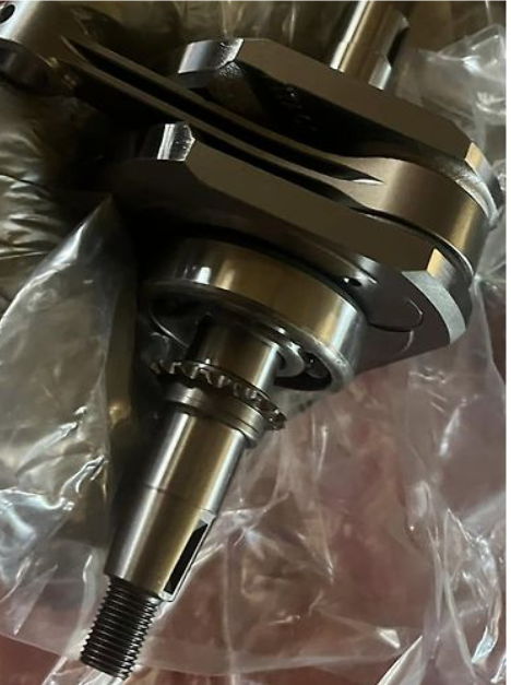 Metal mechanical component on a clear plastic background