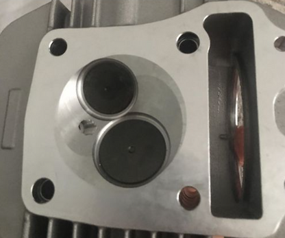Metal mechanical component with cylindrical holes on a metallic background