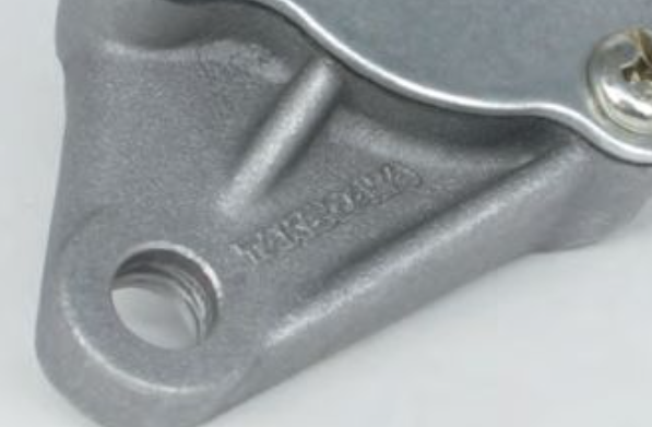 Metal mechanical component with 'Mitsubishi' branding on a white background