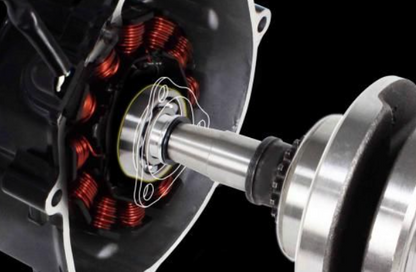 Close-up of a mechanical component with red coils and metallic parts on a black background