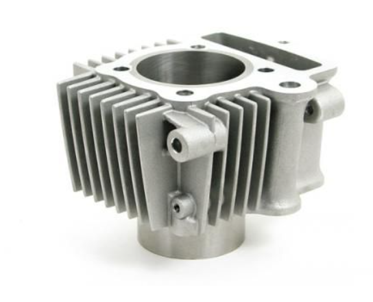Metal engine cylinder head on a white background