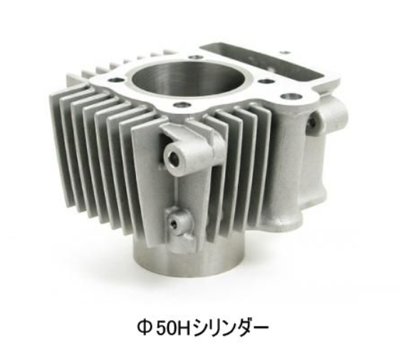 Metal engine cylinder head on a white background with text